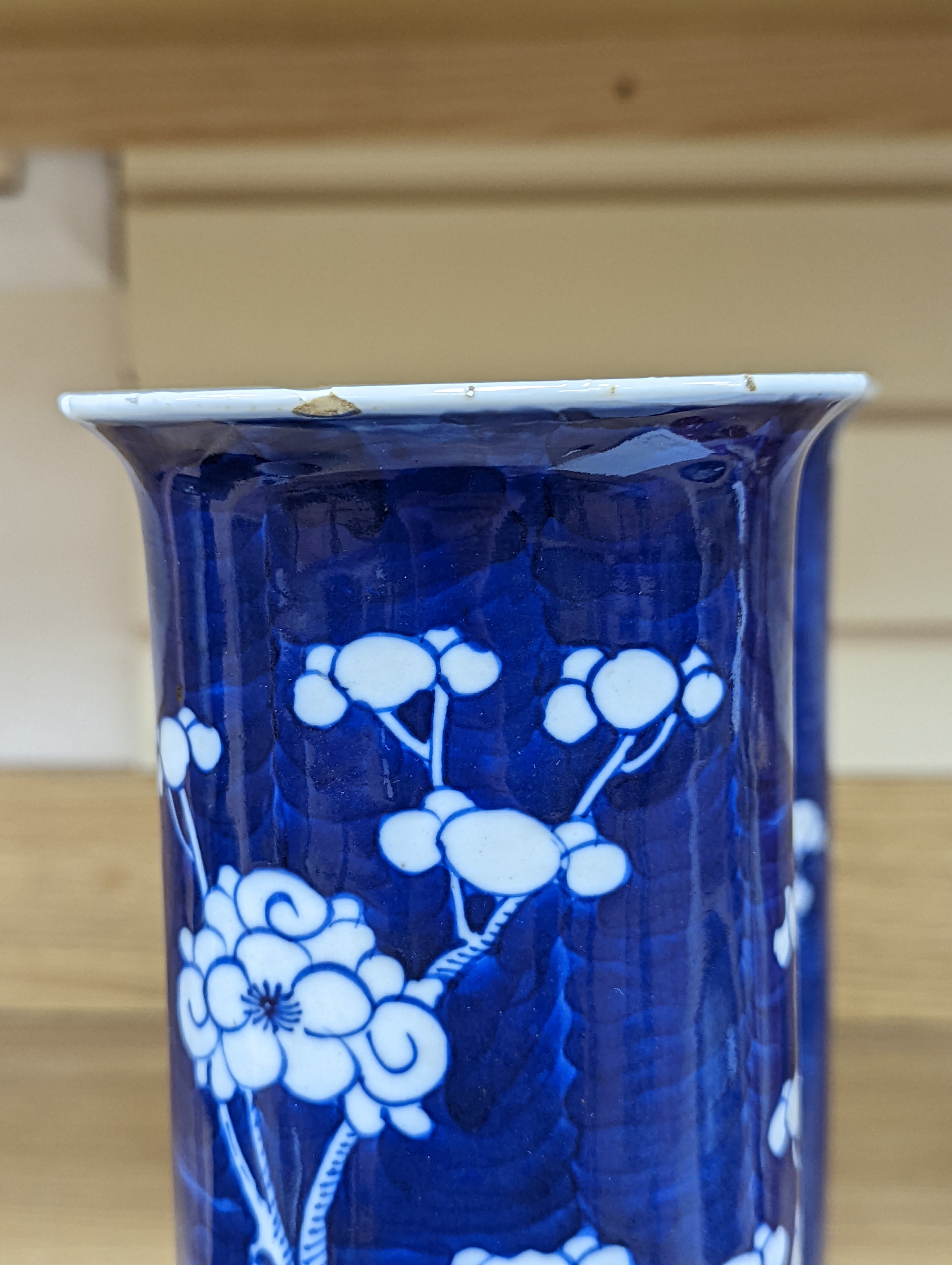 An 18th century Chinese famille rose mug, a Chinese Imari tea caddy and two Chinese blue and white sleeve vases 30cm (4)